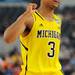 Michigan sophomore Trey Burke pumps his fist during the second half at Cowboys Stadium on Sunday, March 31, 2013. Melanie Maxwell I AnnArbor.com
